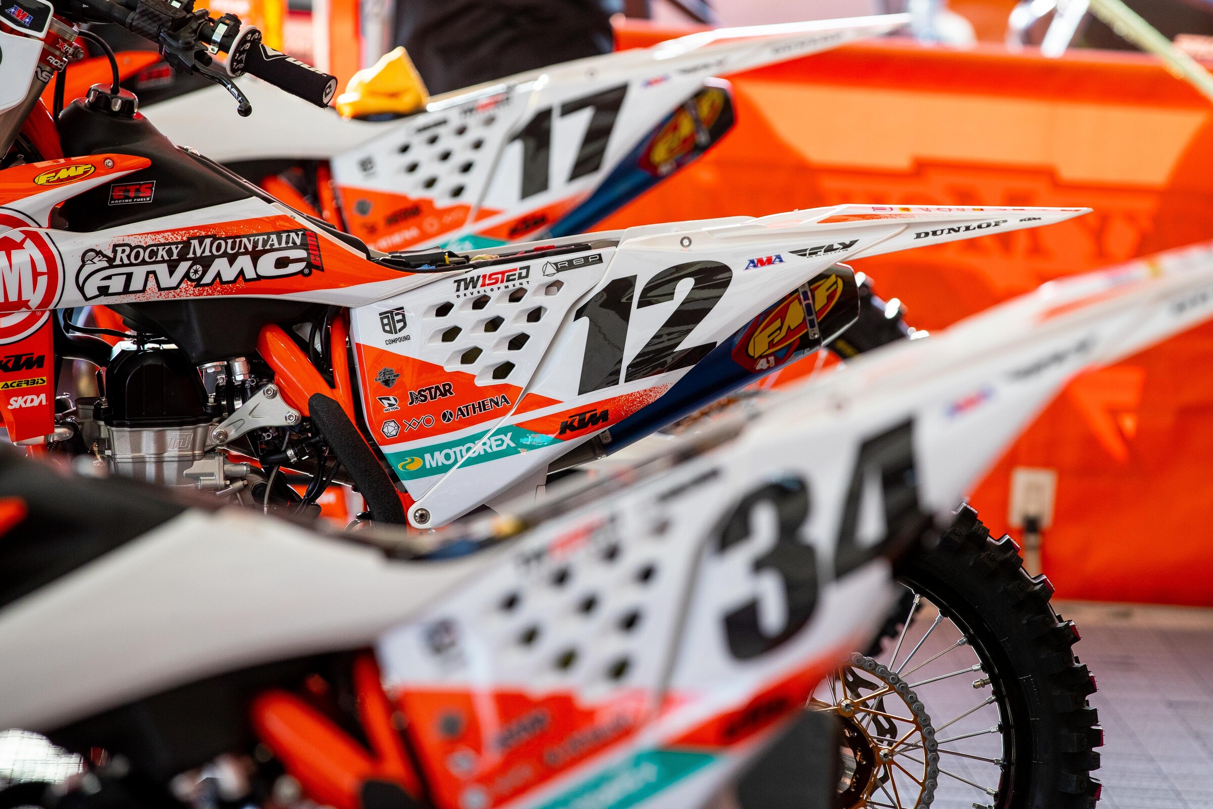 The Rocky Mountain ATV/MC team KTM 450 SX-F machines under the team tent at the 2022 Oakland Supercross.