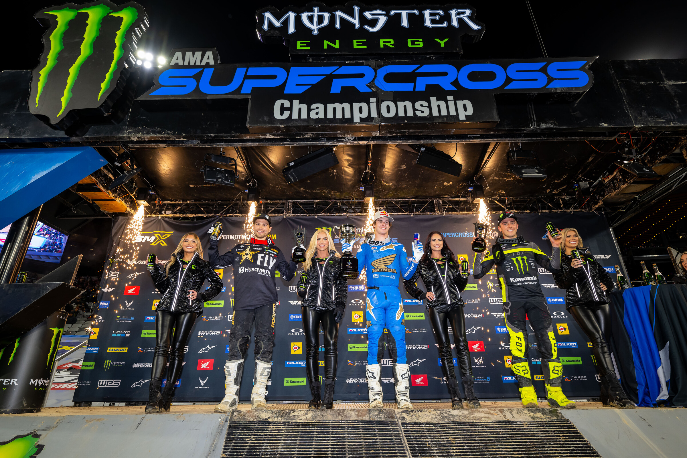 The 2023 San Diego Supercross 250SX West Region main event podium: Jett Lawrence (Honda), RJ Hampshire (Husqvarna), and Cameron McAdoo (Kawasaki).