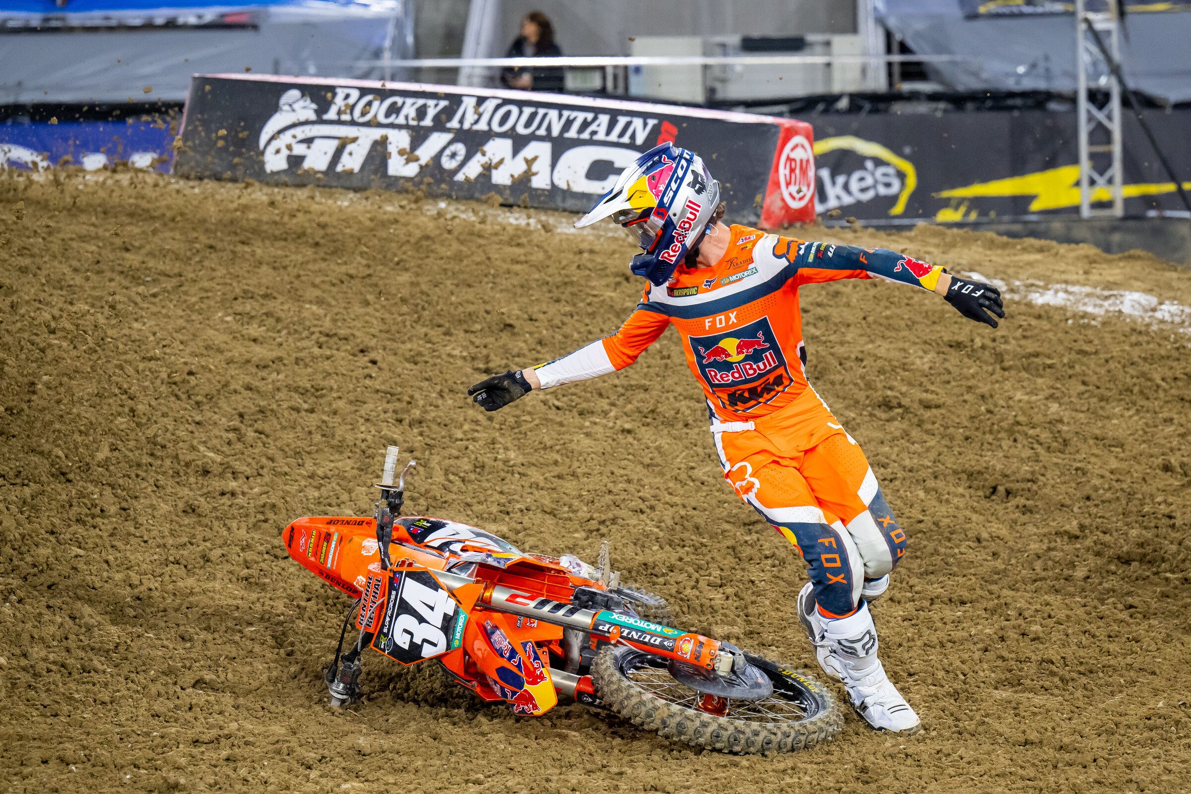 Max Vohland runs back to his KTM in the heat race at San Diego