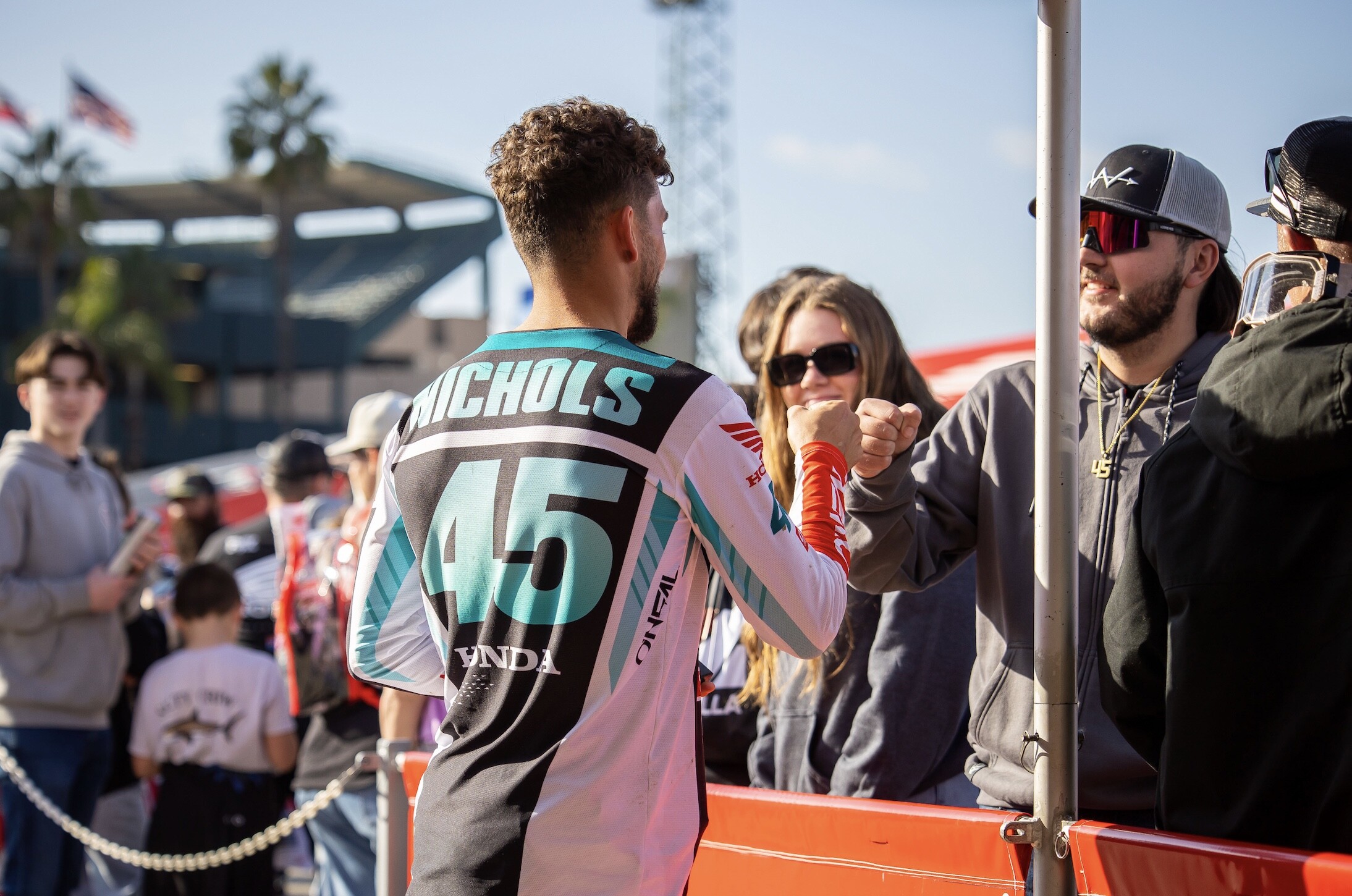 Nichols greets his fans (check out his necklace). 
