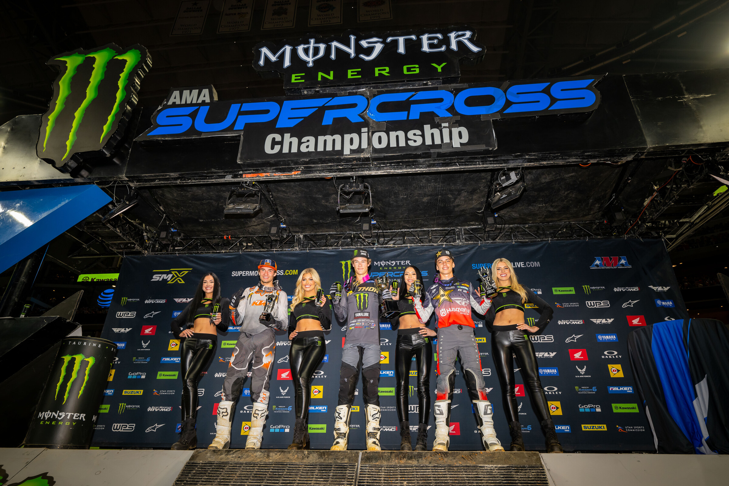 The 2023 Arlington Supercross 250SX Futures main event podium: Daxton Bennick (center), Casey Cochran (right), and Preston Boespflug.