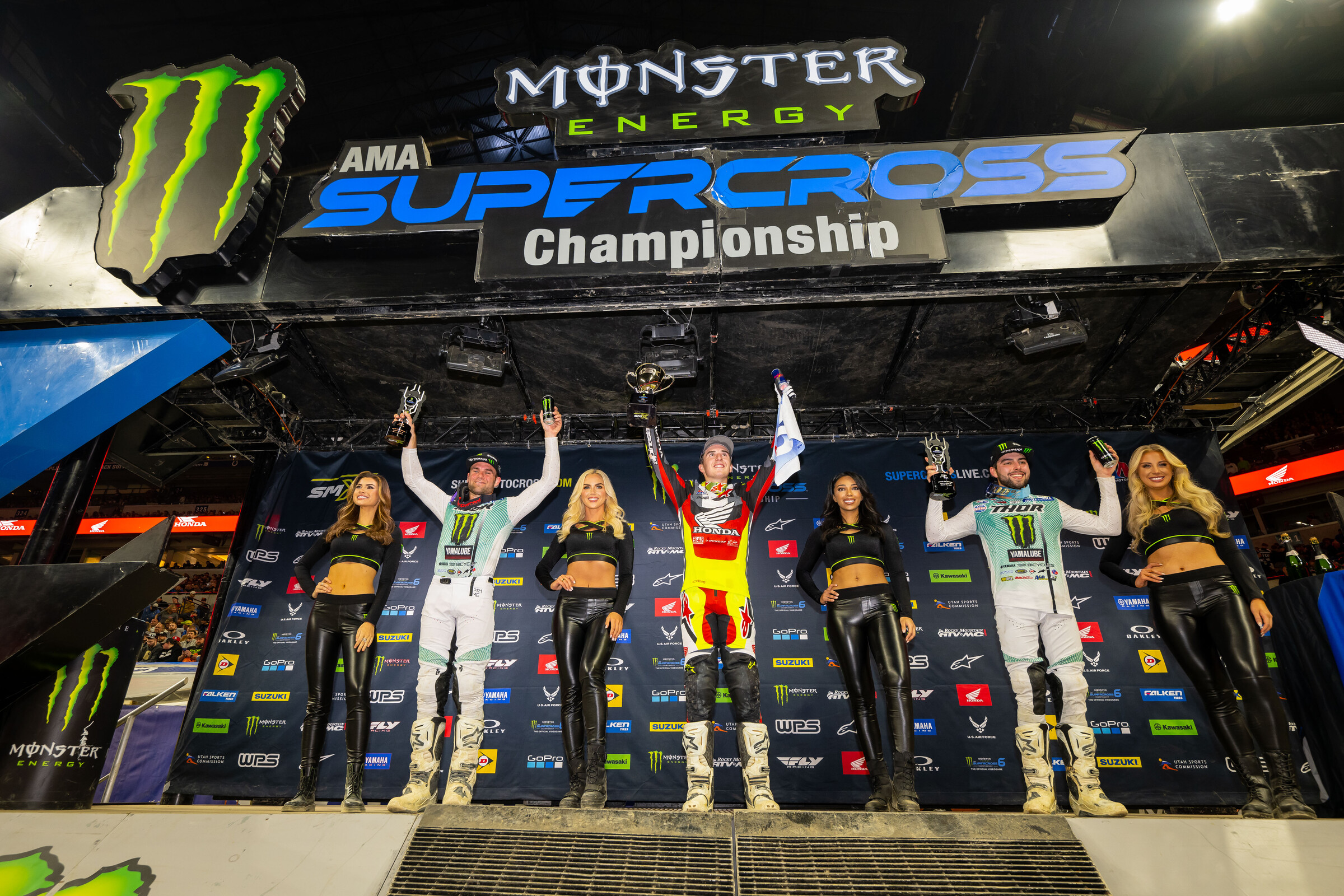 The 2023 Indianapolis Supercross 250SX main event podium: Hunter Lawrence (Honda), Nate Thrasher (Yamaha), and Jordon Smith (Yamaha).