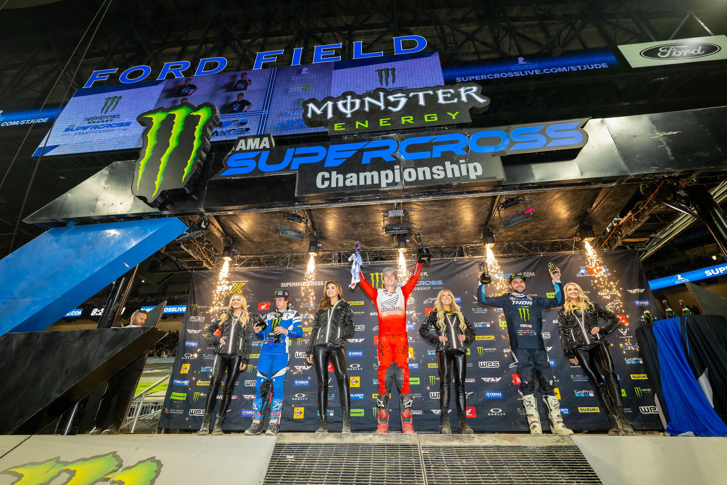 The 2023 Detroit Supercross 250SX main event podium: Hunter Lawrence (Honda), Nate Thrasher (Yamaha), and Haiden Deegan (Yamaha).