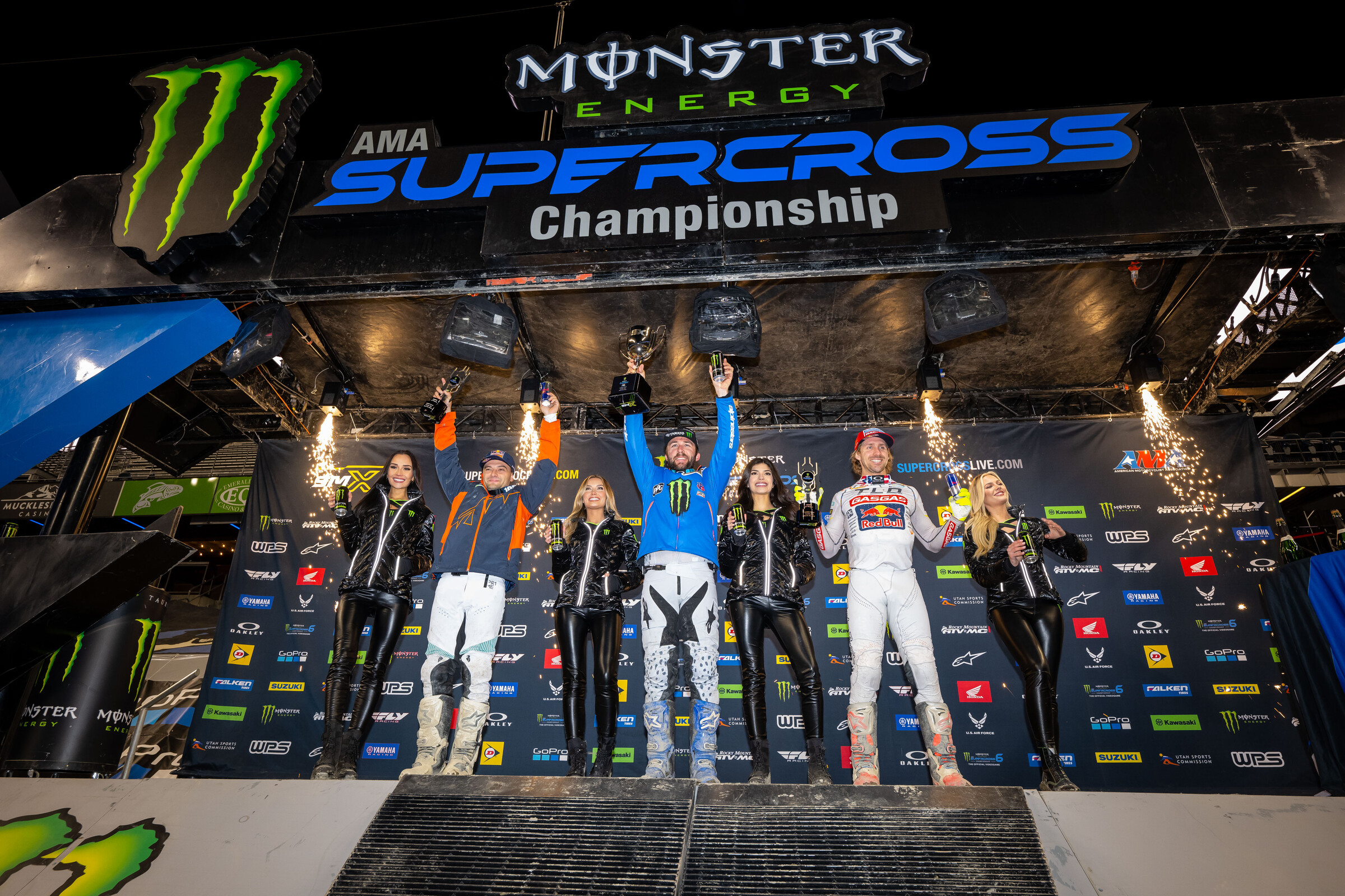 The 2023 Seattle Supercross 450SX main event podium: Eli Tomac (Yamaha), Cooper Webb (KTM), and Justin Barcia (GasGas).