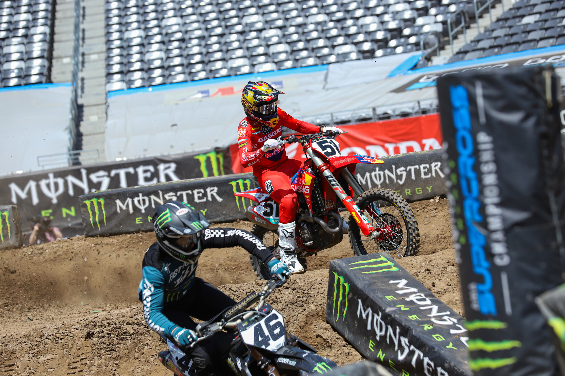 Justin Barcia goes outside in the elevated turn as Justin Hill goes inside.