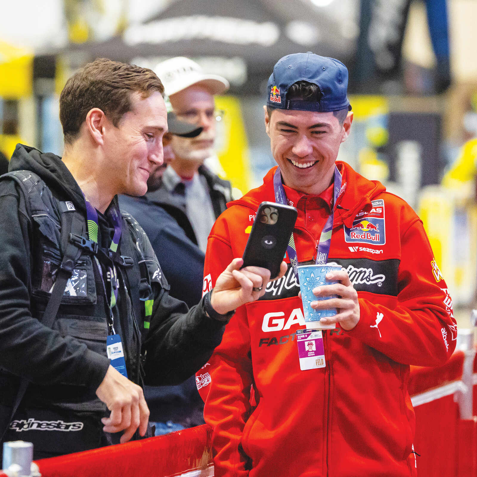 Align Media’s Mike Emery shows Pierce Brown another funny cat video.