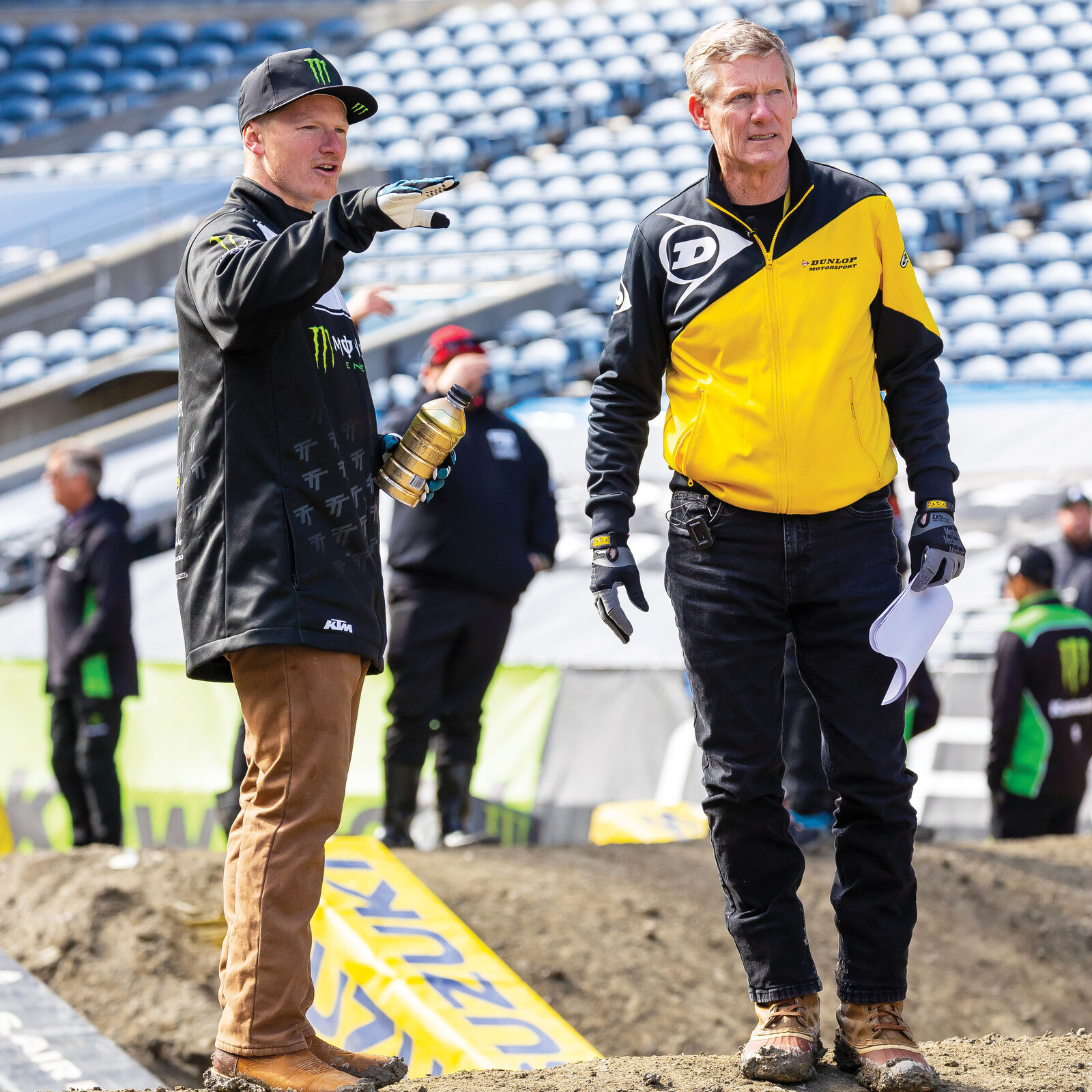 Justin Hill and Broc Glover discuss line and tire options on track walk.