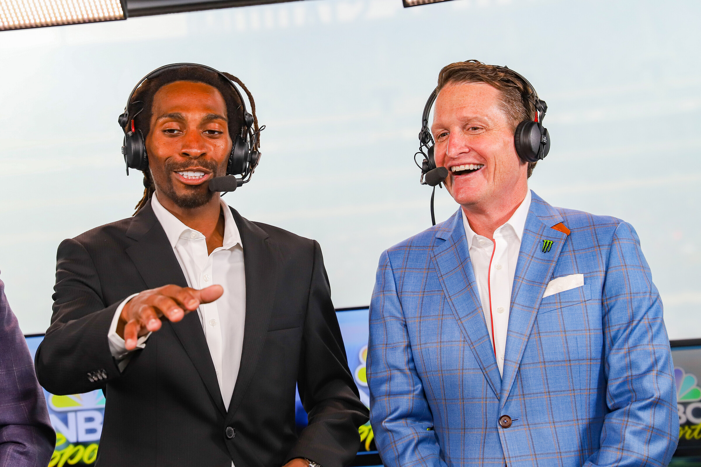 James Stewart and Ricky Carmichael watching a monitor in the broadcast booth during the pre-race show in East Rutherford, New Jersey.