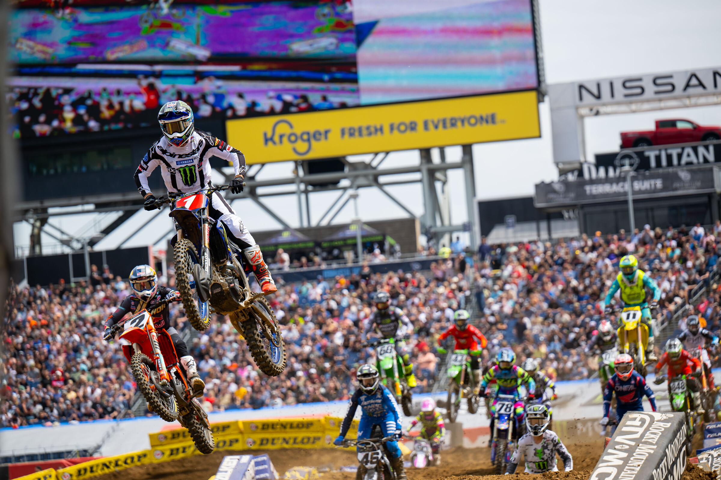 Tomac and Webb ahead of the field at the start of the first 450SX heat race at the Nashville Supercross.