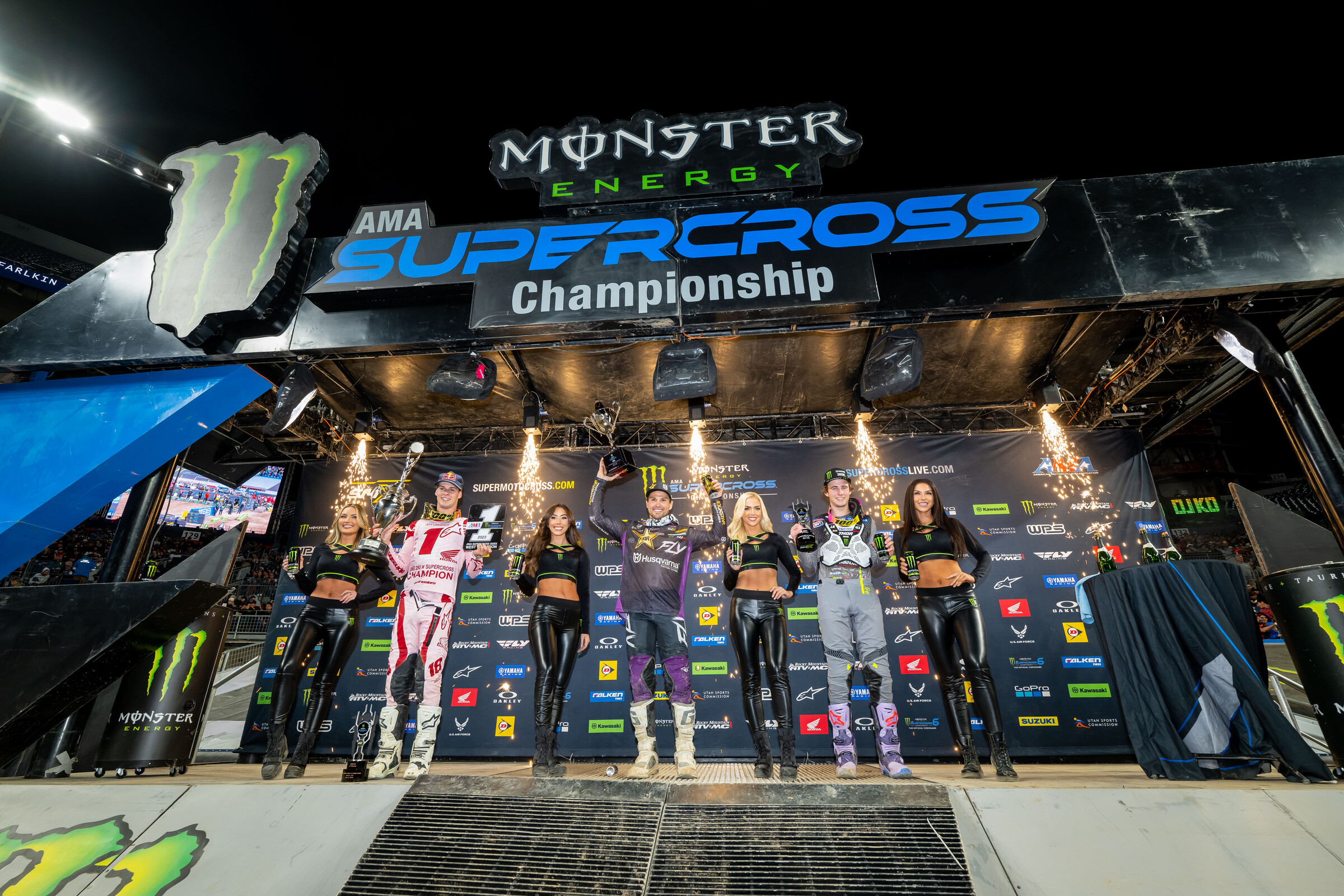 The 2023 Denver Supercross 250SX main event podium: RJ Hampshire  (center, first), Levi Kitchen (right, second), and Jett Lawrence (left, third).