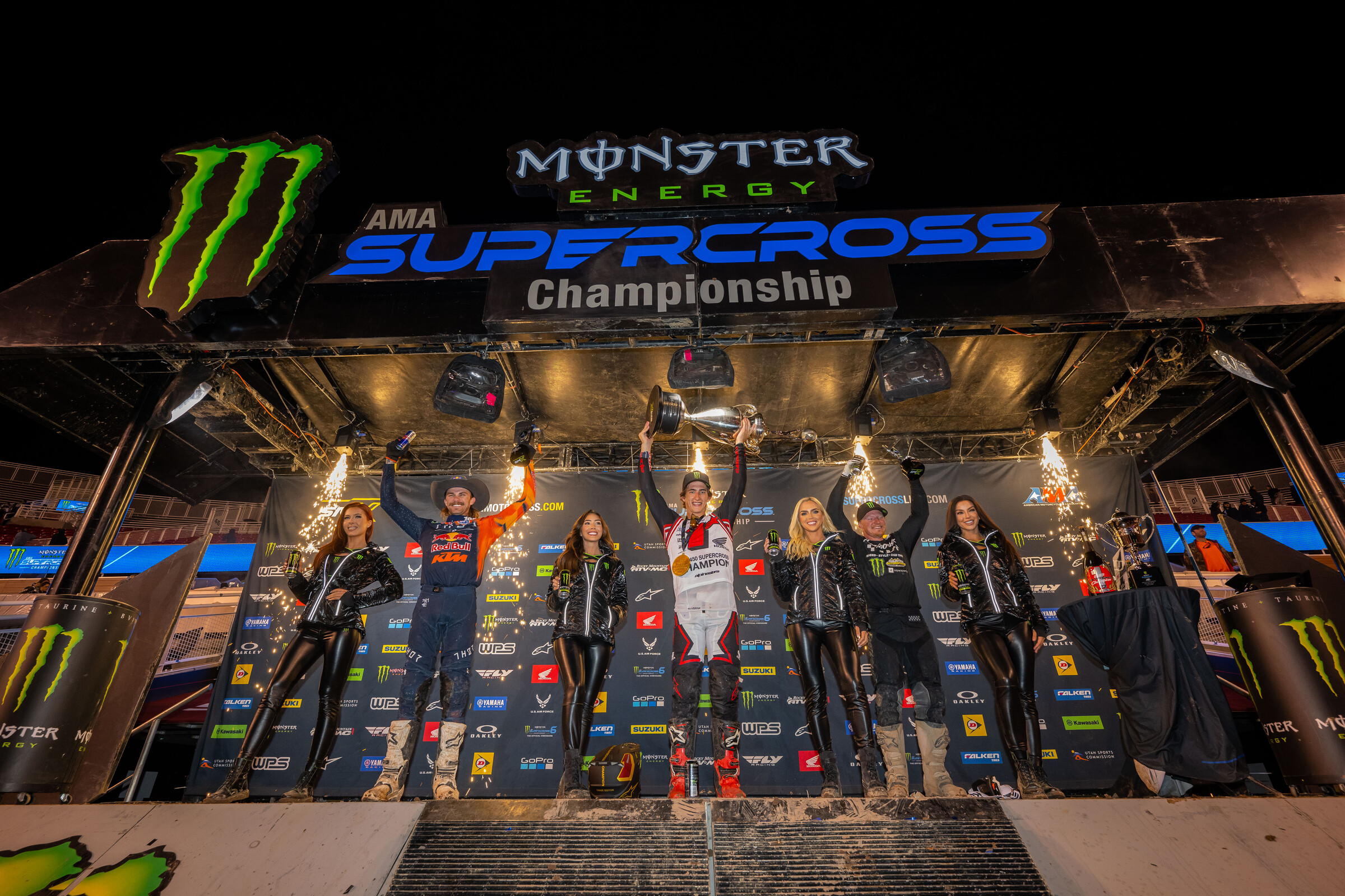 The 2023 Salt Lake City Supercross 450SX main event podium: Chase Sexton (Honda), Aaron Plessinger (left, second), and Justin Hill (right, third).