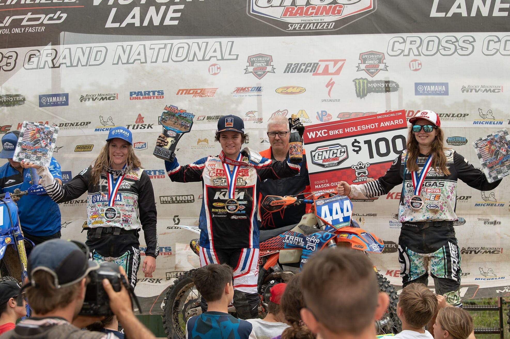 Korie Steede (center), Rachael Archer (left) and Rachel Gutish (right) rounded out the top three WXC finishers at round eight.