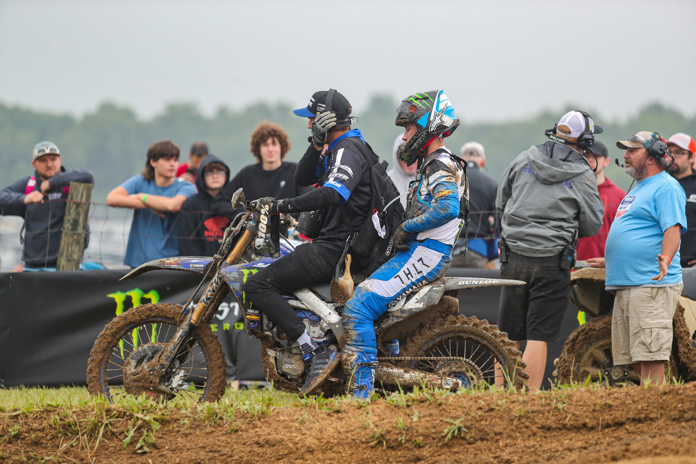 Cooper rides off on the back of his bike with his mechanic Daniel Castloo.