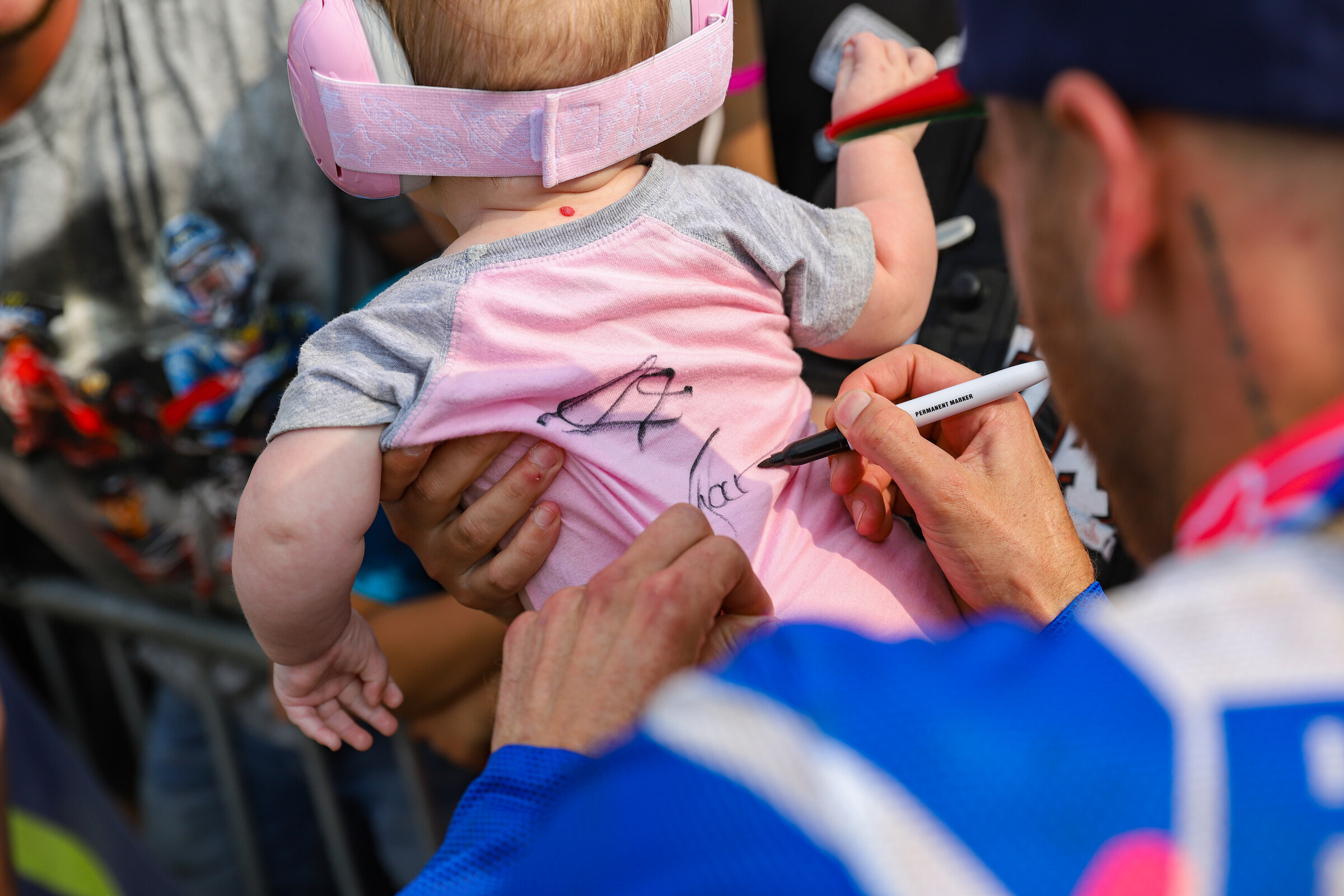 This baby's outfit was eventually signed by all three 450 Class overall podium finishers.