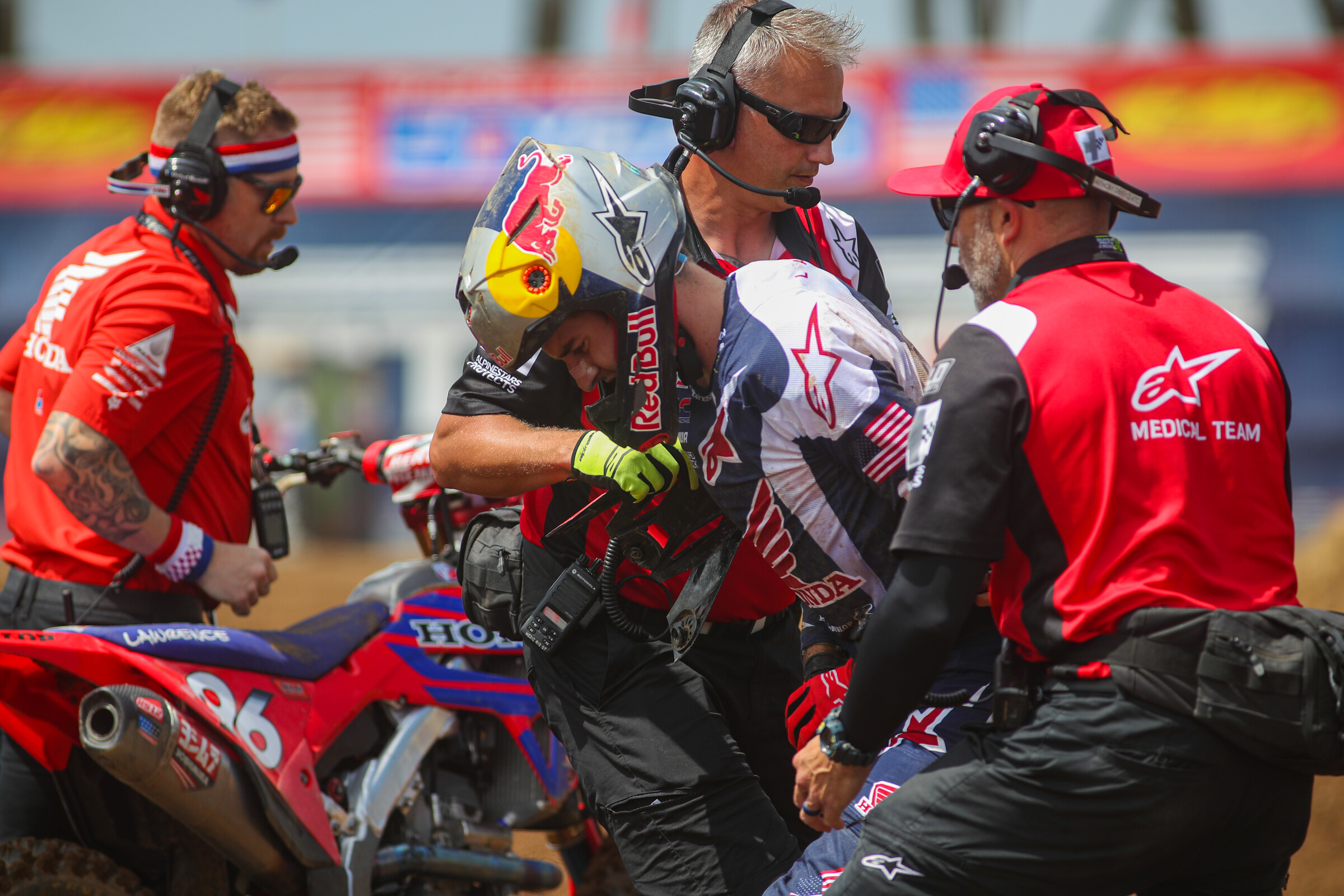 Hunter Lawrence helped to his feet and off the track my the Alpinestars medical team.