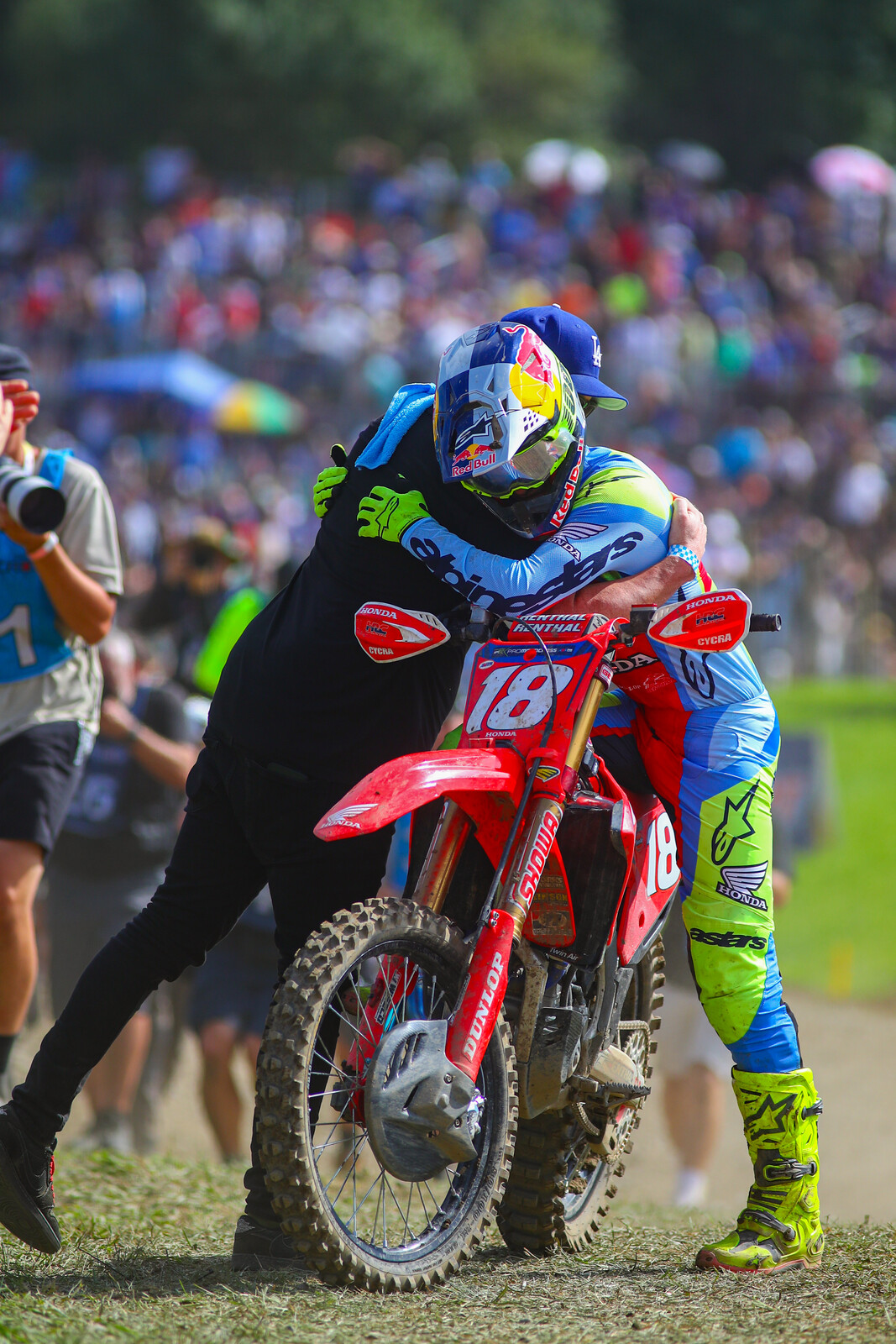 Jett embraced by his agent, Lucas Mirtl, who originally pitched American teams on the Lawrences coming to the U.S.