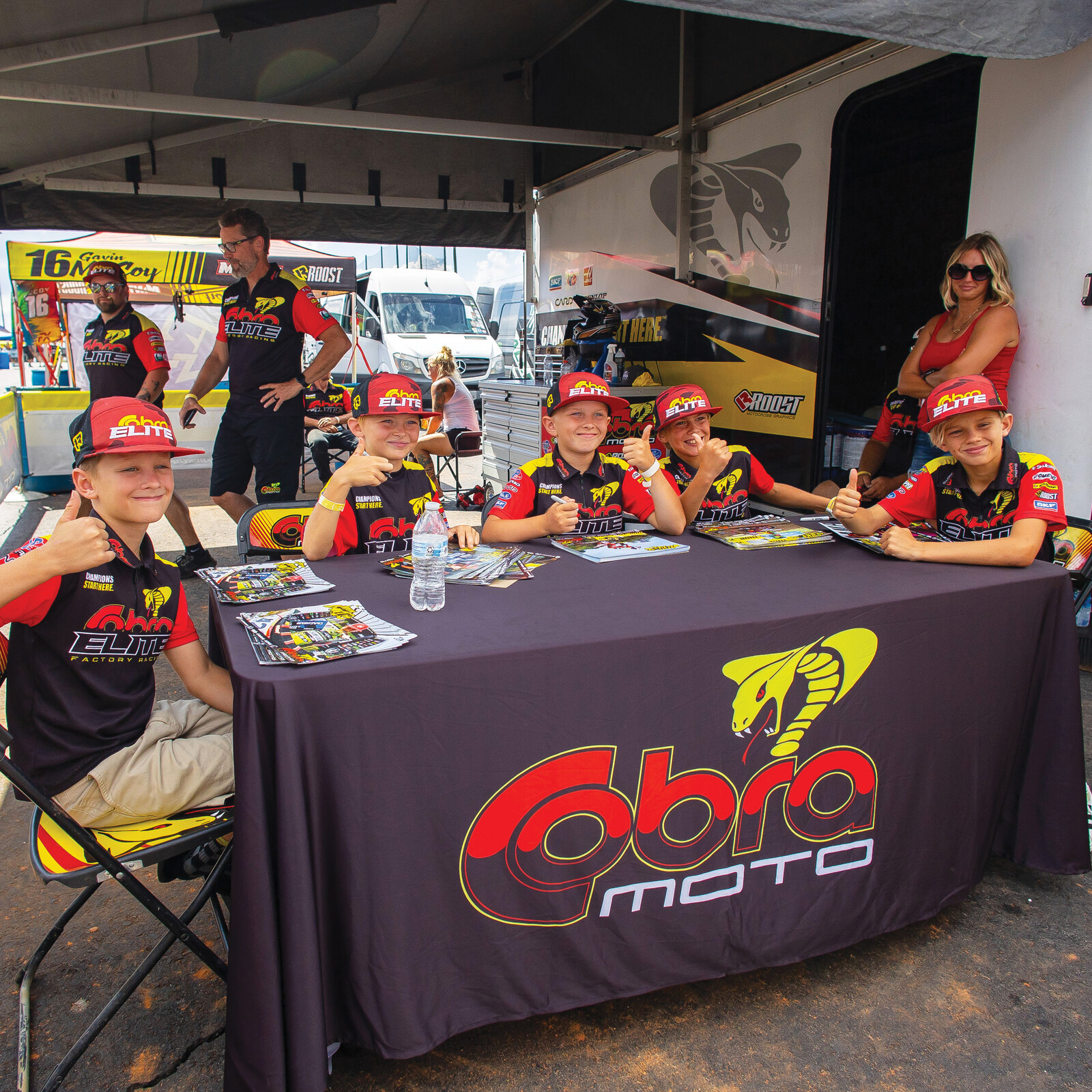 Cobra kids practicing their thumbs-ups between autographs. 