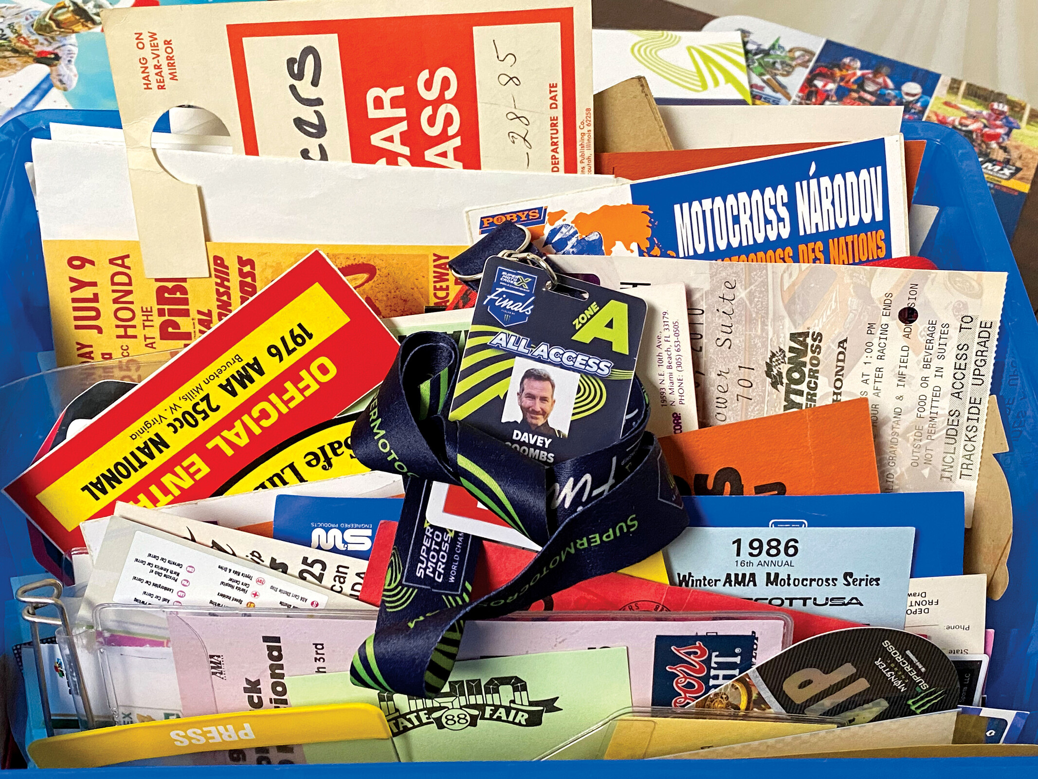 box of event tickets, pit passes, AMA licenses, hard cards, media credentials