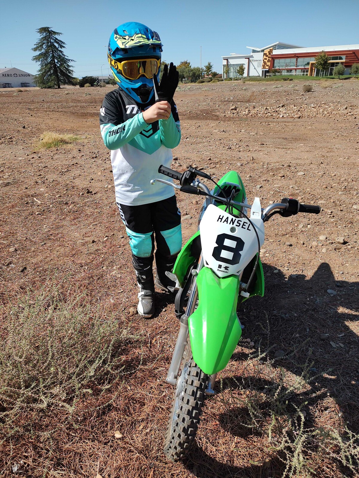 Aaron Hansel's daughter showing him that her glove is too tight, and that is why she got passed. 