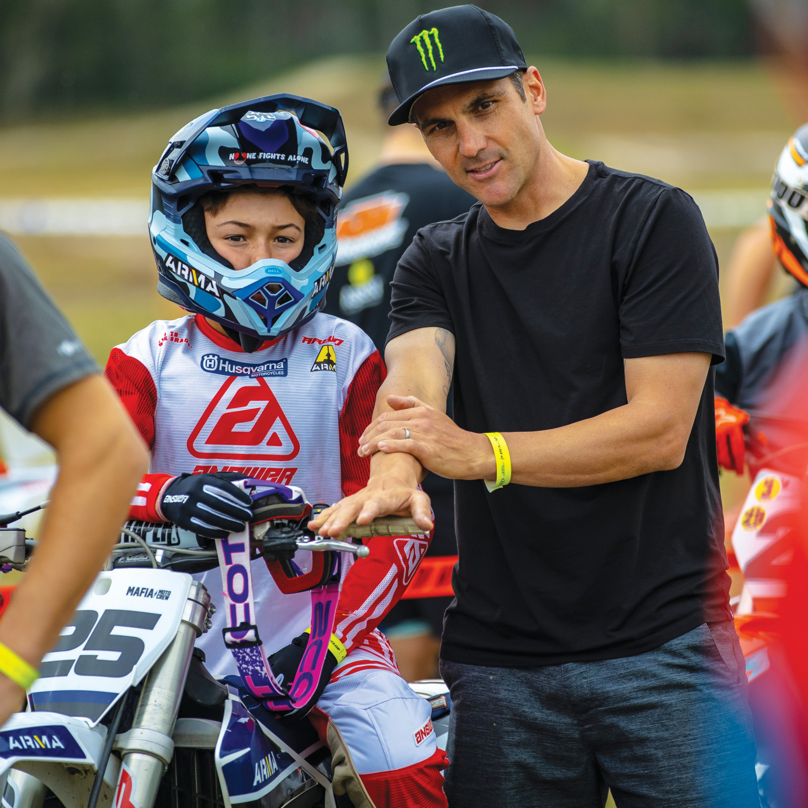 Nick Wey talks holeshots with his son Vincent.