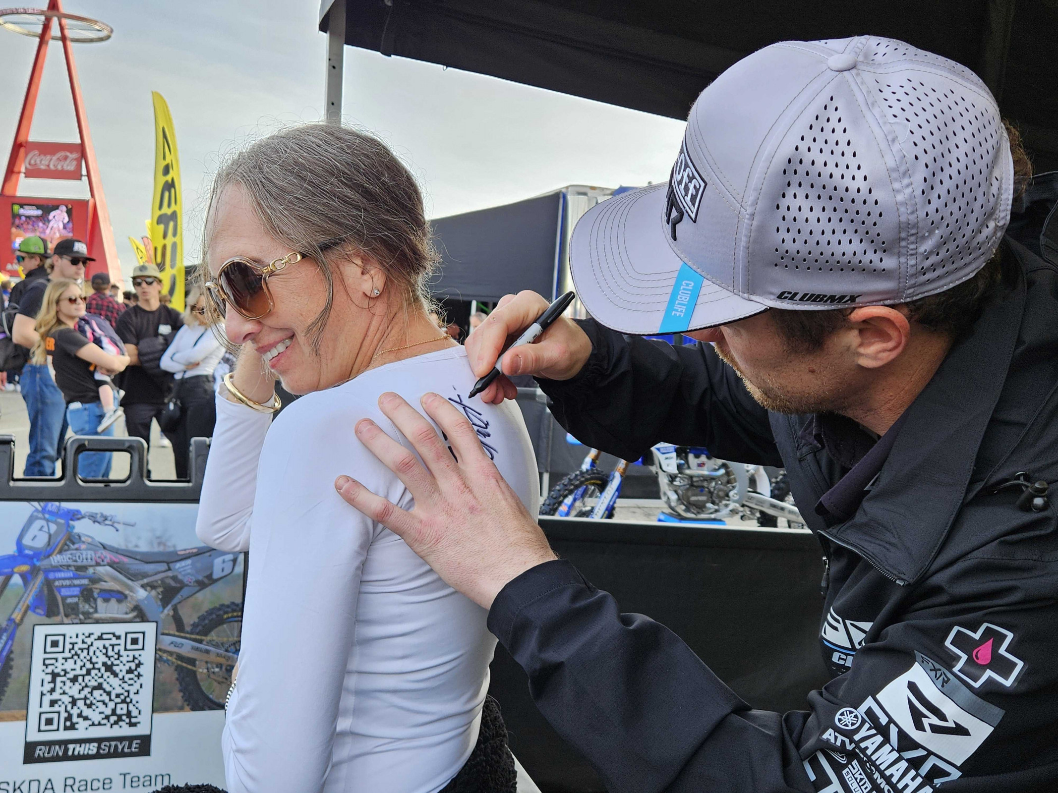 Phil Nicoletti signs an autograph.