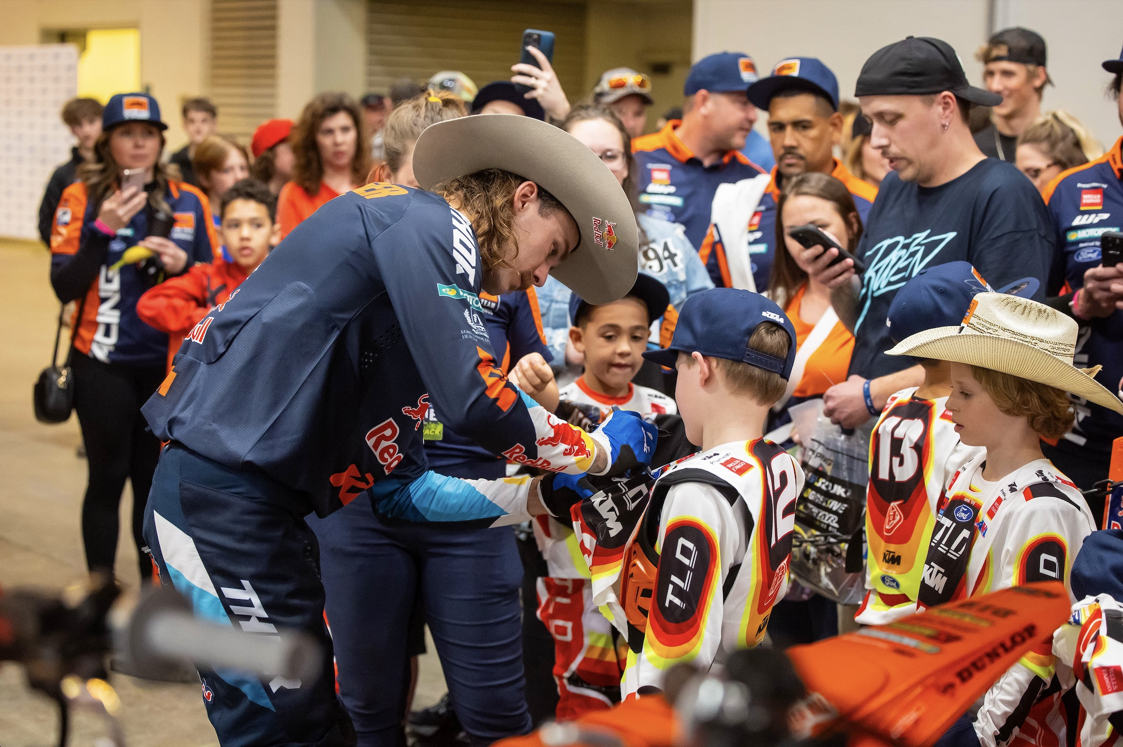 Aaron Plessinger signs autographs for the KTM JR riders.