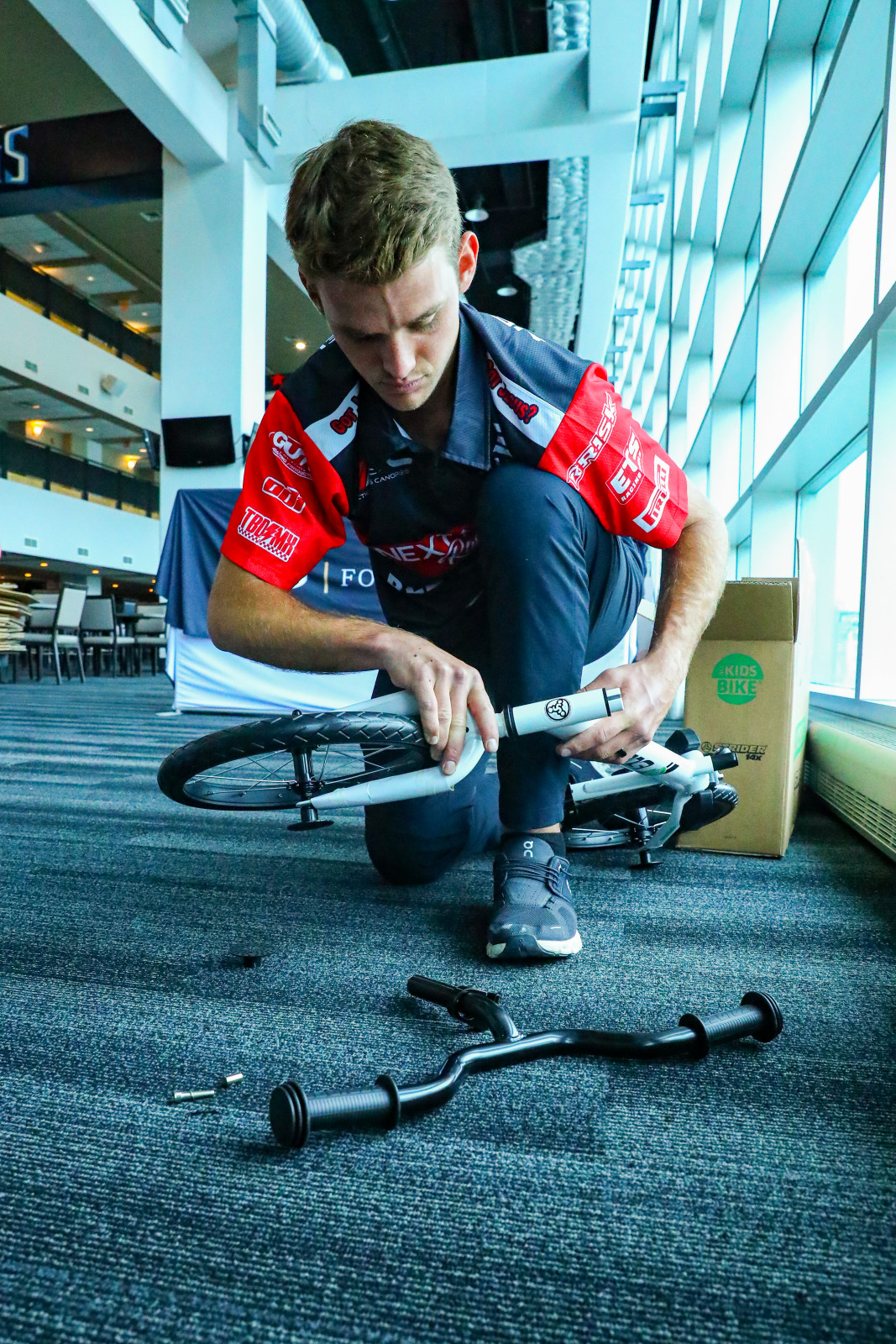 Tristan Lane helps build some bikes.
