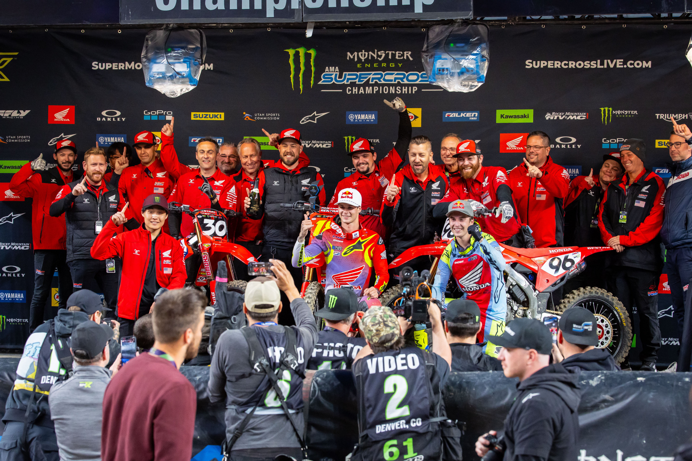The Honda HRC team celebrates Jo Shimoda's 250SX win, Jett Lawrence's 450SX win, and Hunter Lawrence finishing P2 in 450SX.
