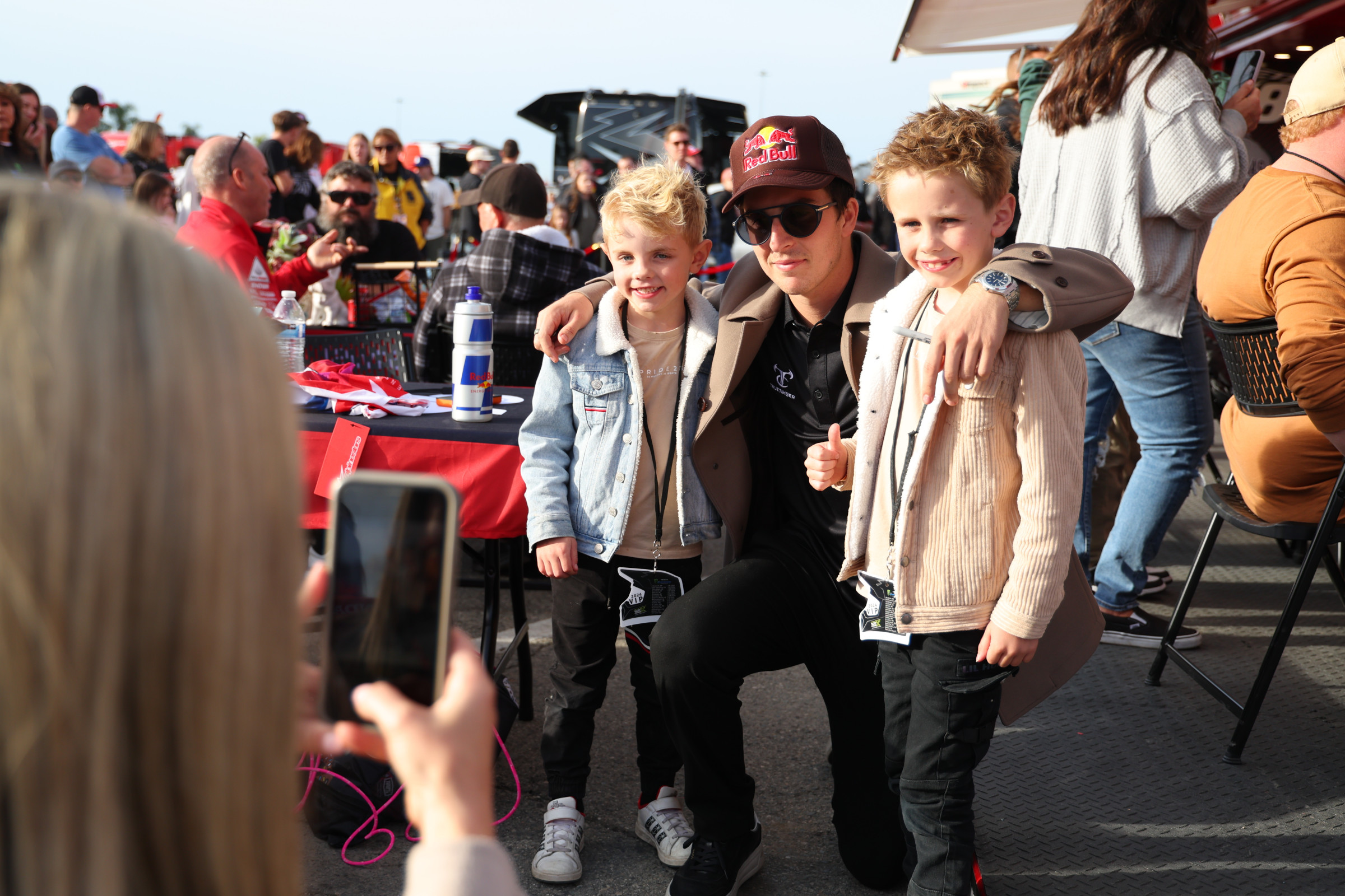 Hunter Lawrence posing with young fans inside the Lawrence Factory Fan Zone which offers unprecedented access to the Lawrence Brothers while also providing a comfortable place to recharge and eat during a busy race day.
