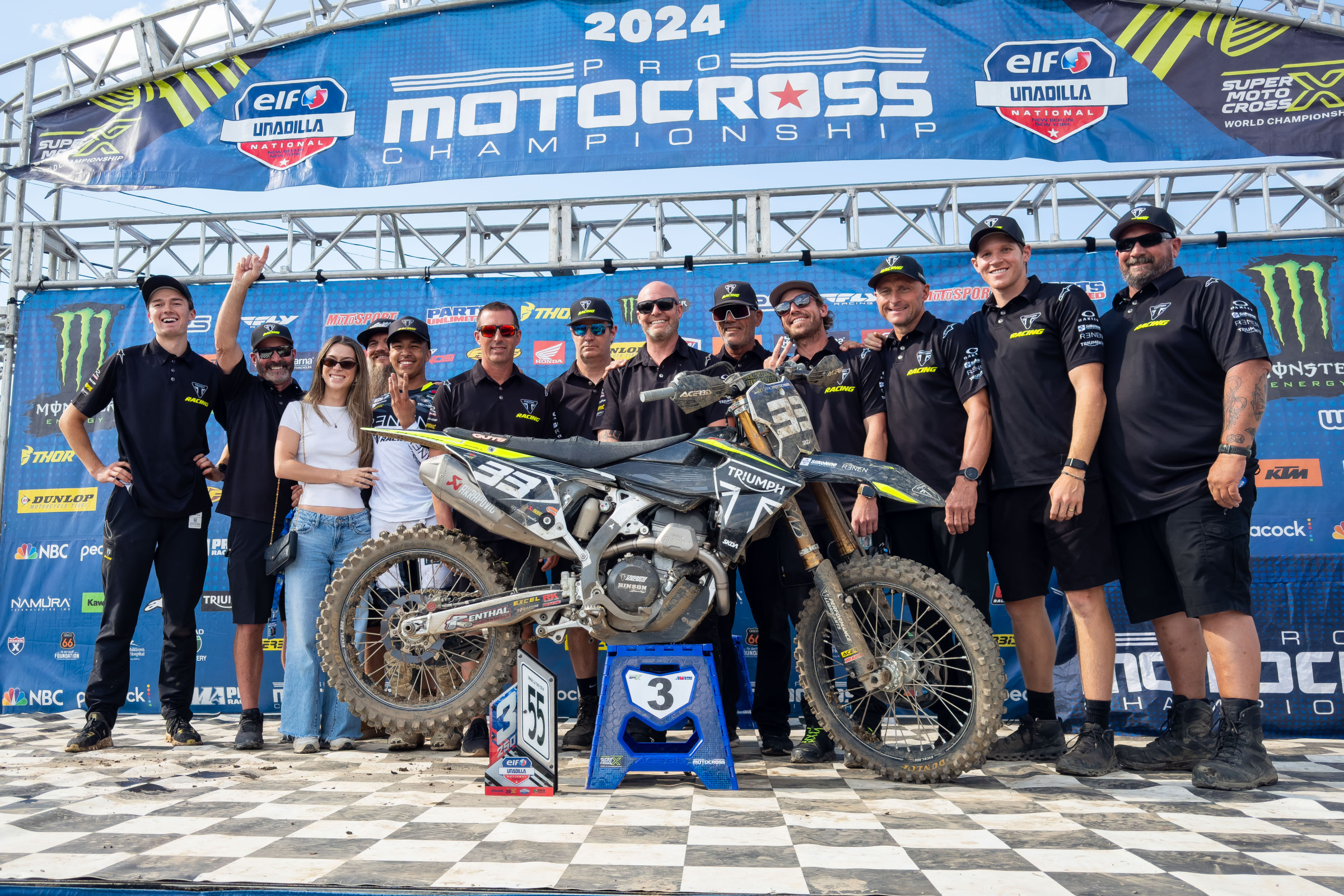 The Triumph Racing crew celebrate Jalek Swoll's third overall at the 2024 Unadilla National in New York.