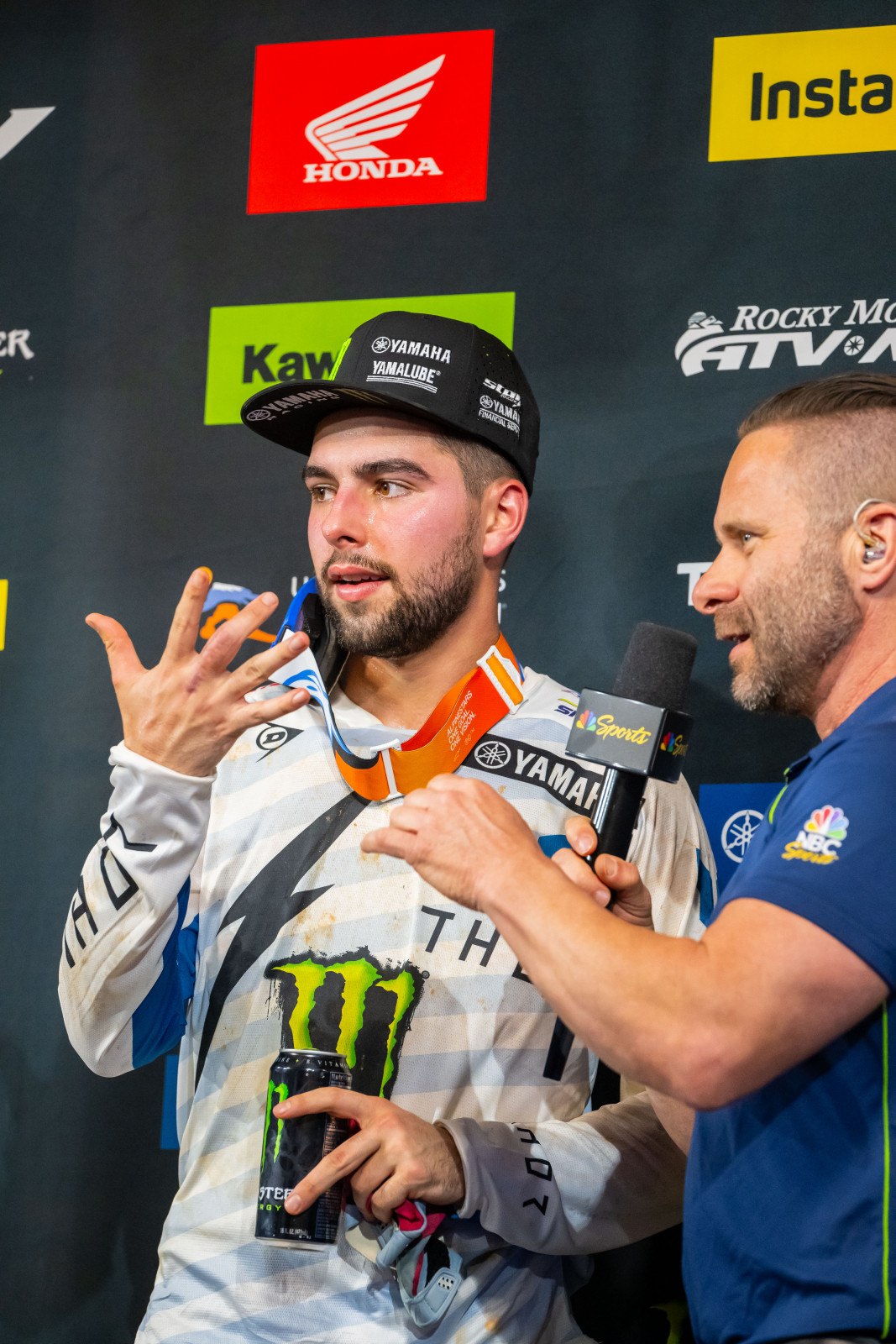 Thrasher showing reporter Jason Thomas and the TV broadcast his hand...