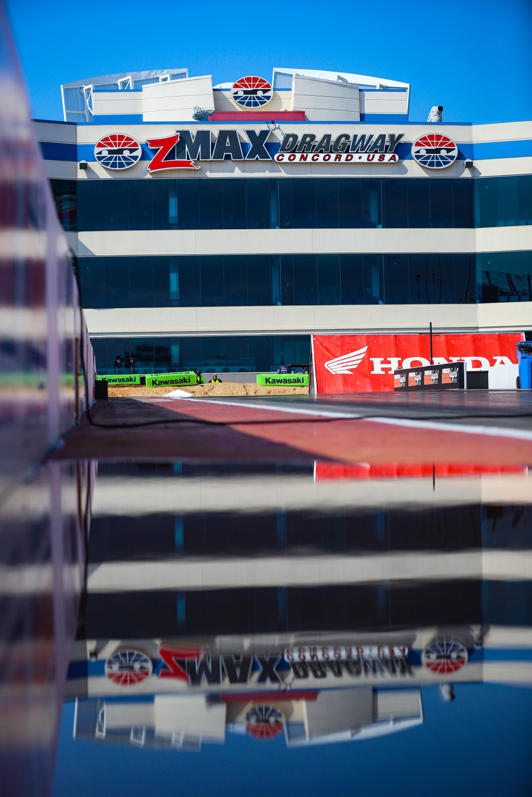 Puddles reflect Thursday evening's rain.