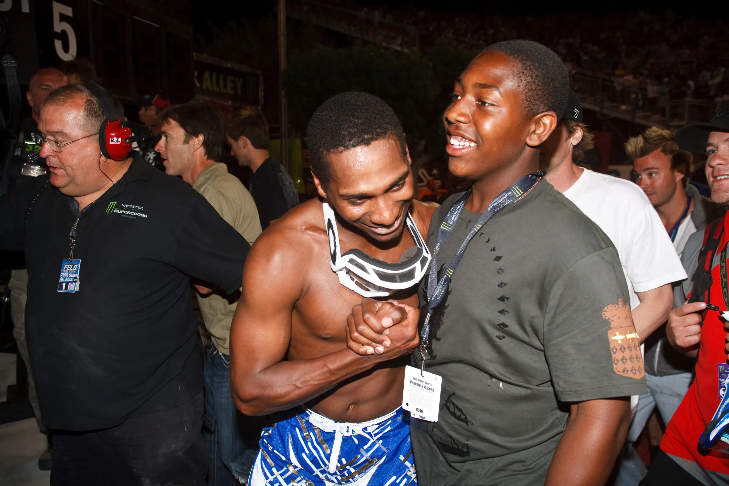 That's a young, dreadless Malcolm Stewart celebrating with James!